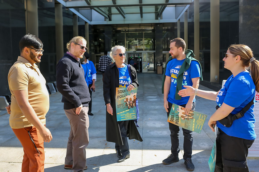 group of volunteers at polls