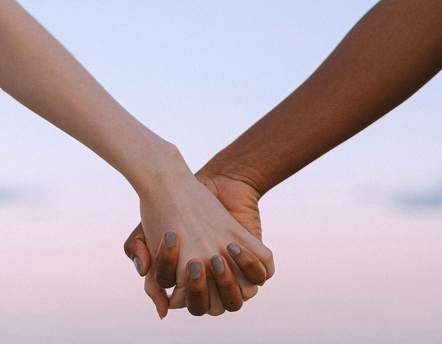 Black and white hands holding