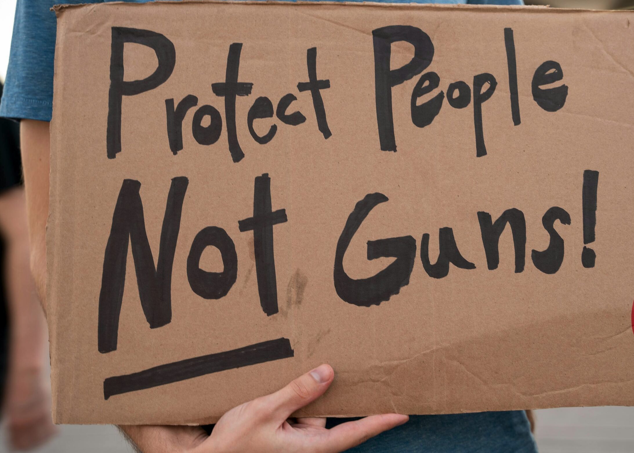 signs says, Protect people not guns