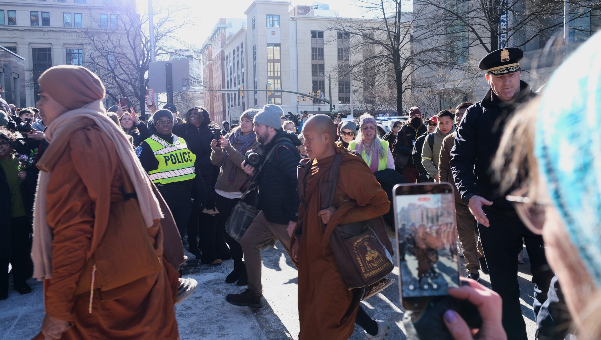 monks in a crowd as they walk for peace in Virginia