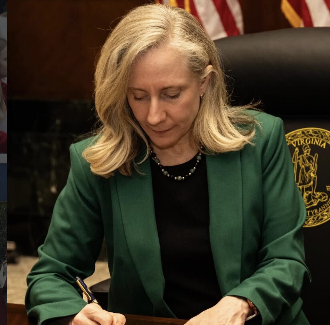 woman with blond hair in a green suit signs document (g=Governor Spanberger)