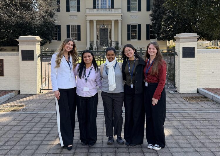 five students stand in front of executive mansion in Richmond
