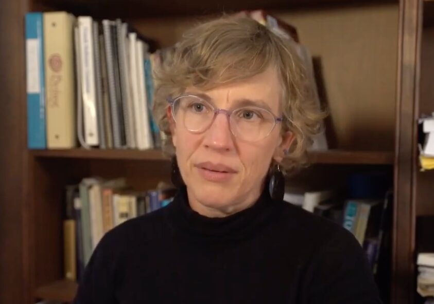 woman with glasses in interview