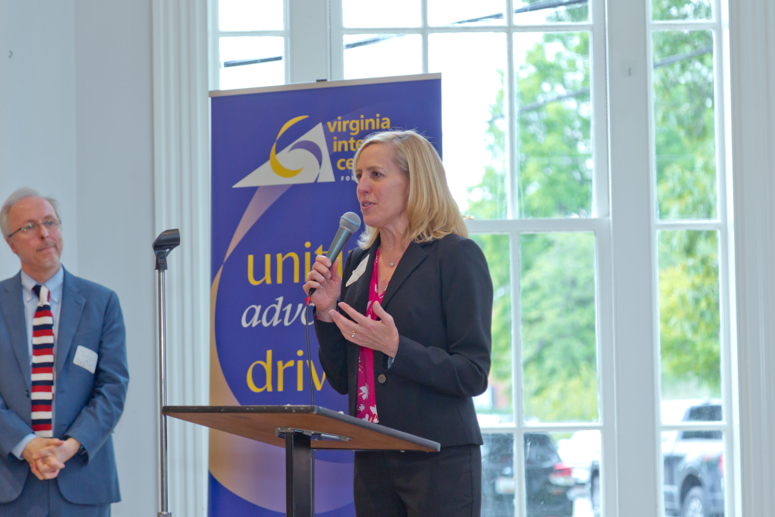 woman pastor speaking at podium