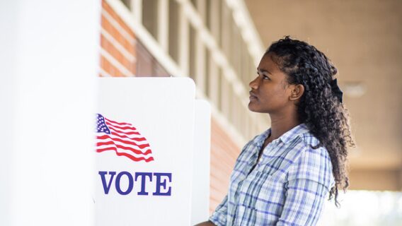 woman at voting booth