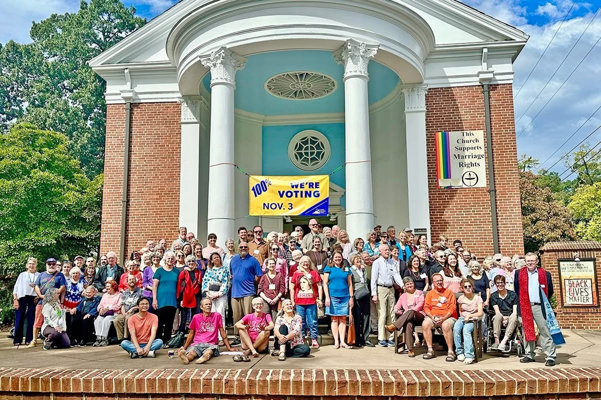 people on steps of church